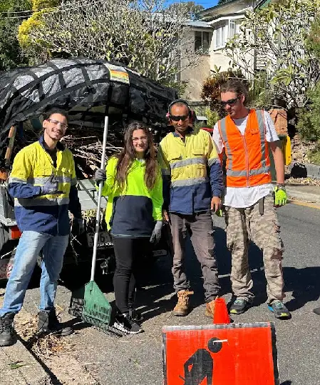 Oxley GPM team mulching around a large tree as part of sustainable garden maintenance in a Brisbane residential property