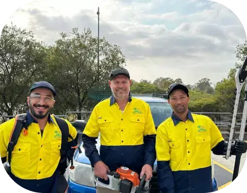Oxley Team Oxley GPM gardening team smiling with hedge trimmers and safety gear before starting residential garden maintenance in Brisbane.